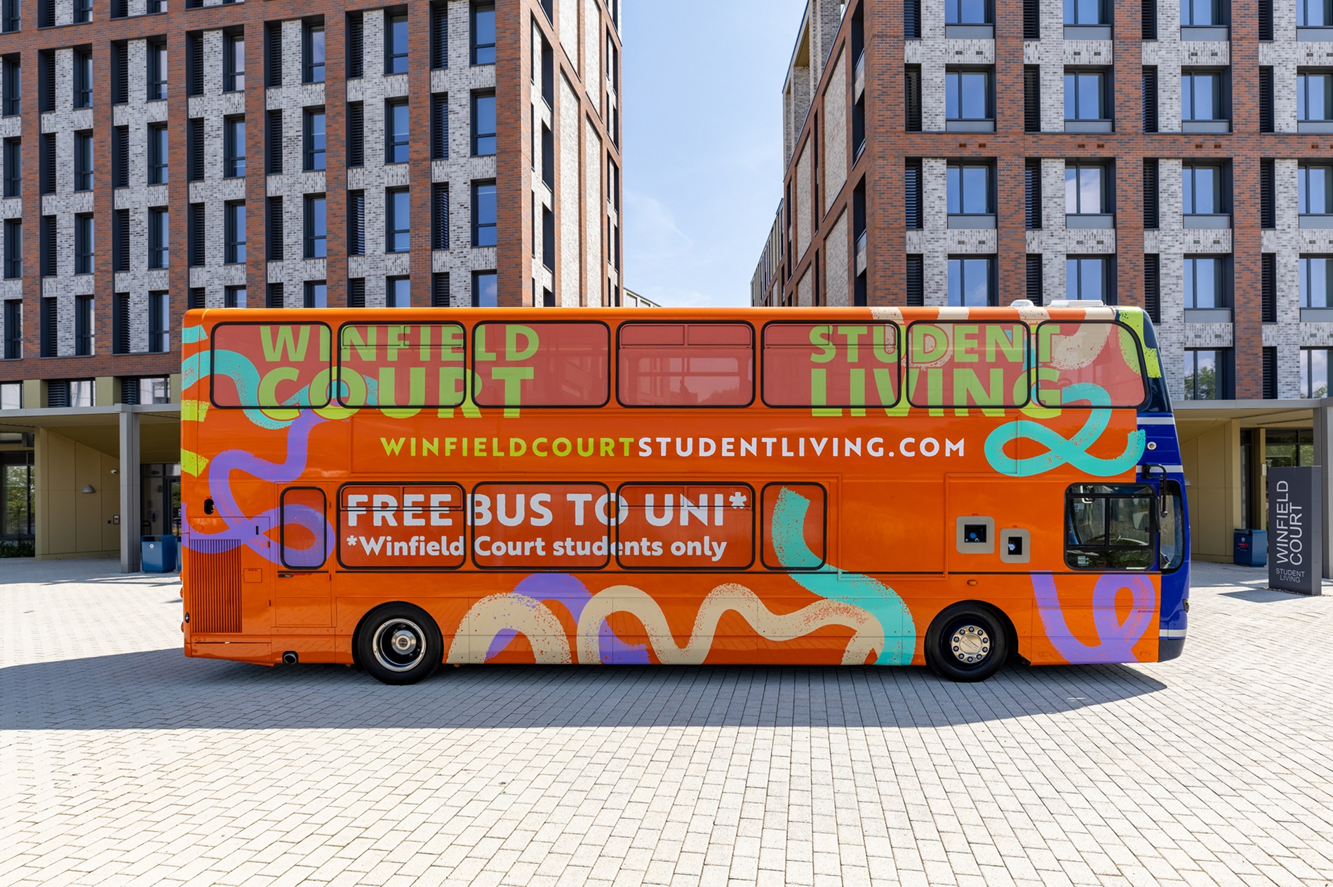 Free shuttle bus parked outside Winfield Court